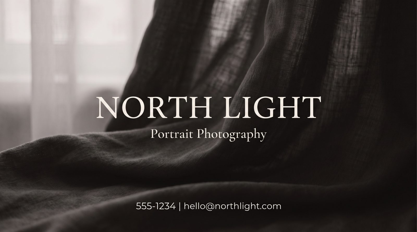 Front of a photography studio business card shown at actual print size