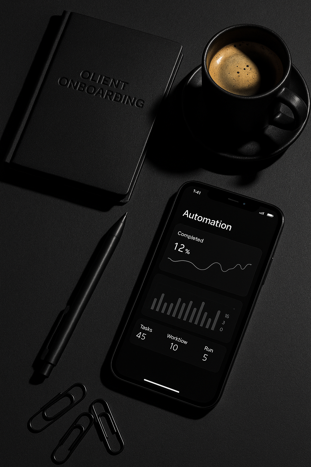 Tools for client onboarding automation featuring elegant black workspace with notebook, smartphone, and coffee cup representing streamlined business processes